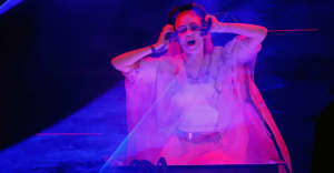 Grimes DJs at a “Keep AI open” party but says she disagrees with the sentiment